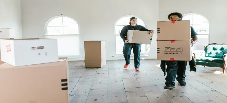 People unpacking in new apartment