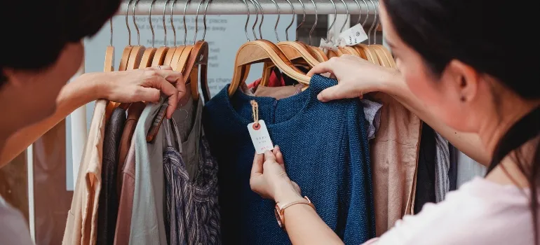 two girls looking at clothes