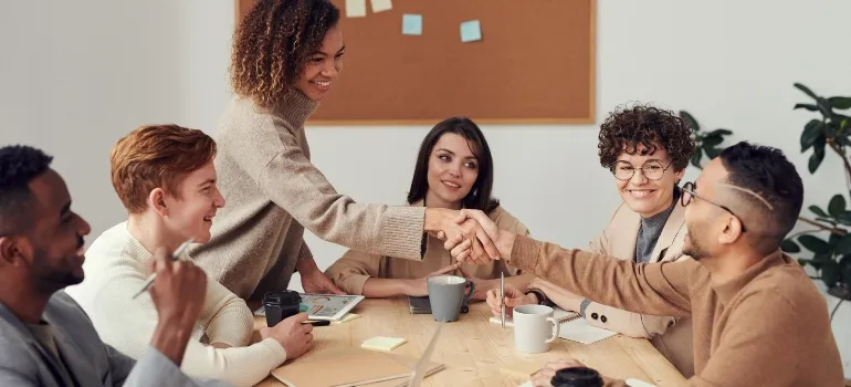 two people shaking hands after successfully moving business from Rockville to Silver Spring