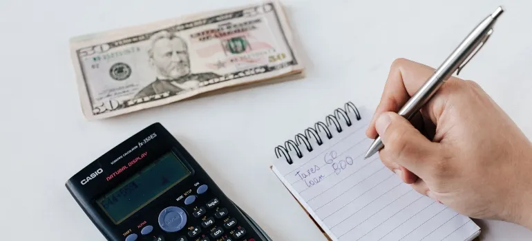 Person organizing a move to Maryland on a budget