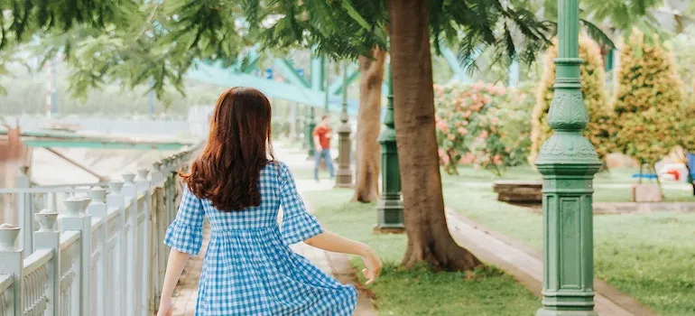 woman walking trough the park