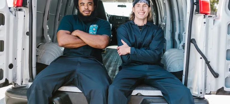 two guys siting in van