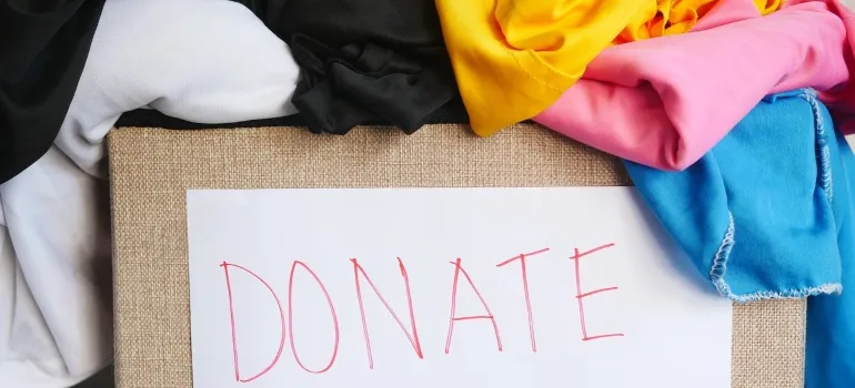 box with clothes with donate label