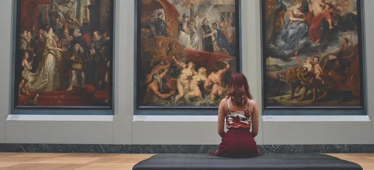 woman siting in a museum looking at Washington DC's hidden gems
