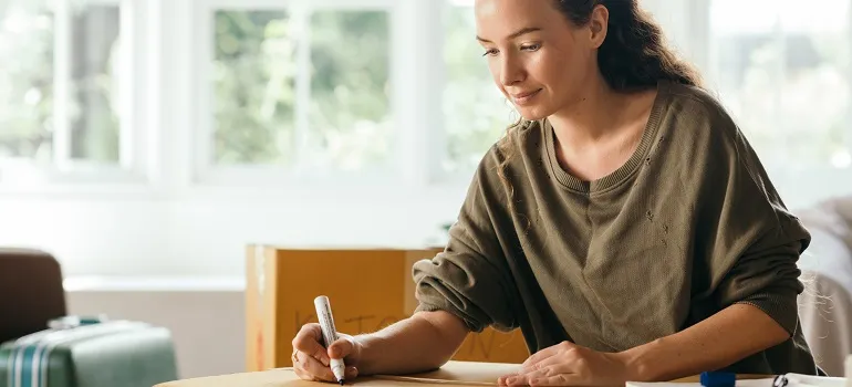 a girl preparing a moving list
