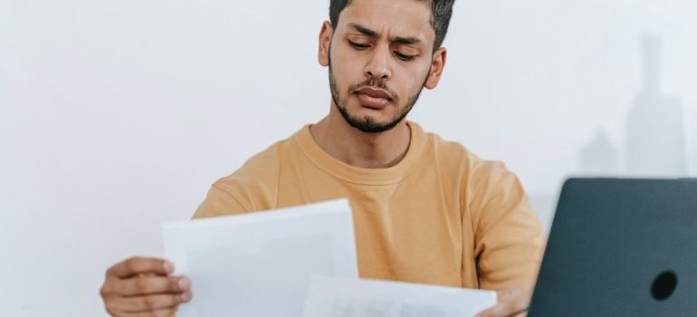 a man doing taxes for an economical Maryland move