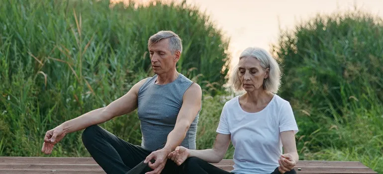 a couple meditating
