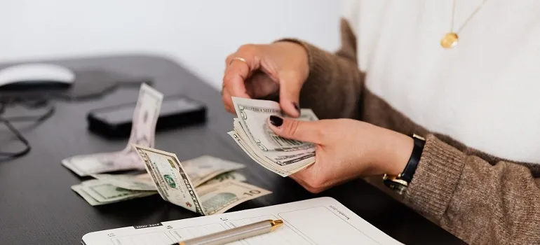 a woman counting bills