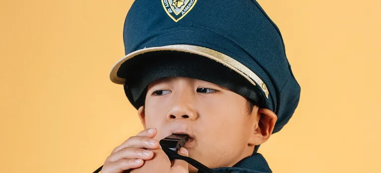 a boy in a police uniform