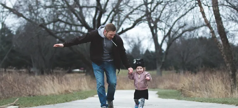 a father and his kid running around
