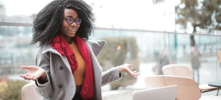a girl using her laptop outside