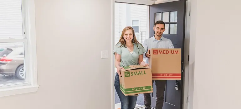 a family moving into their new home with the help of movers in Damascus MD