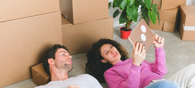 a couple researching Montgomery Village MD moving companies