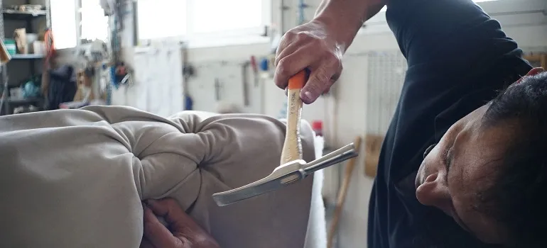 a man attempting to prepare furniture for a long distance move