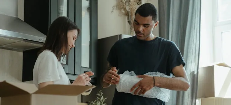 a couple packing their items