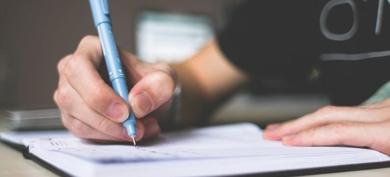 person writing something