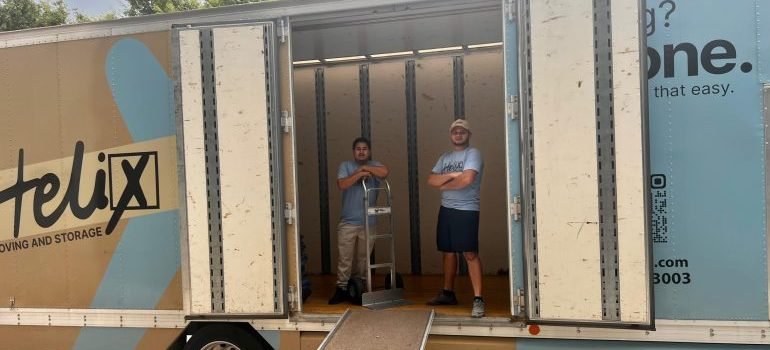 Movers loading a moving van during an urgent relocation from Clarksburg to Potomac.