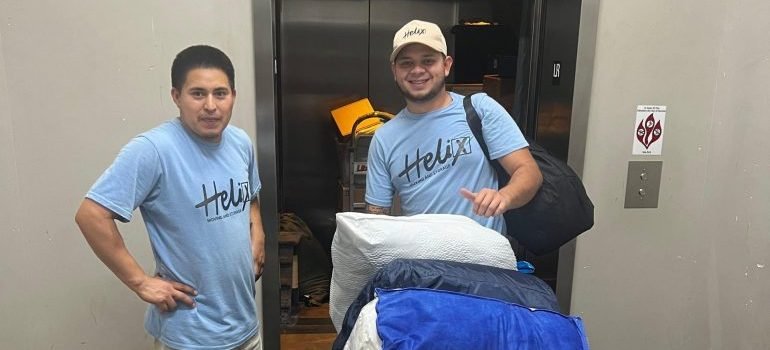 Professional movers with some packed items.