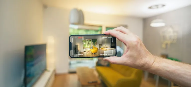 A person taking a video of the room.