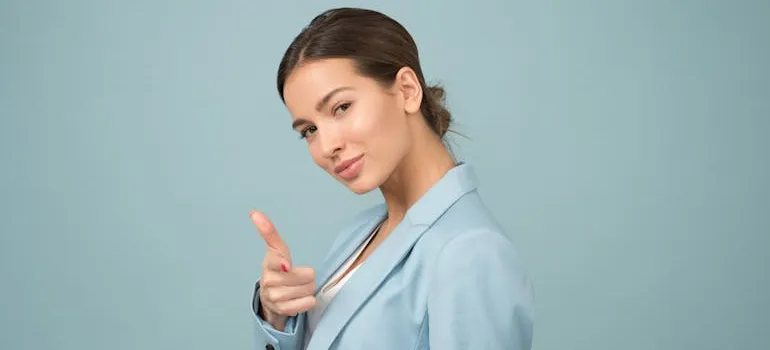 A young businesswoman in a formal outfit smiling because she is satisfied with Bethesda’s job market