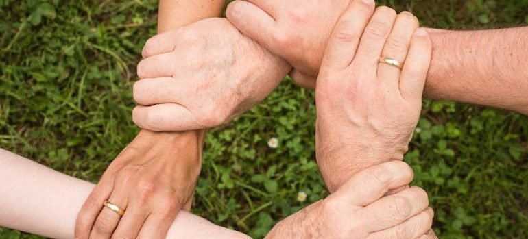 People holding each other's arms