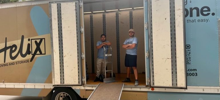 Professional movers inside a moving truck.