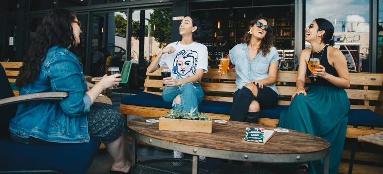 Four Women Chatting about What You’ll Love About Rockville After Moving from Poolesville