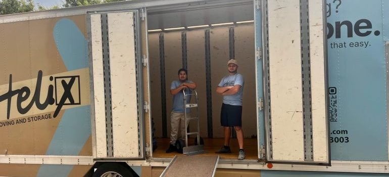 Professional movers in a moving truck before uploading it with items for relocation.