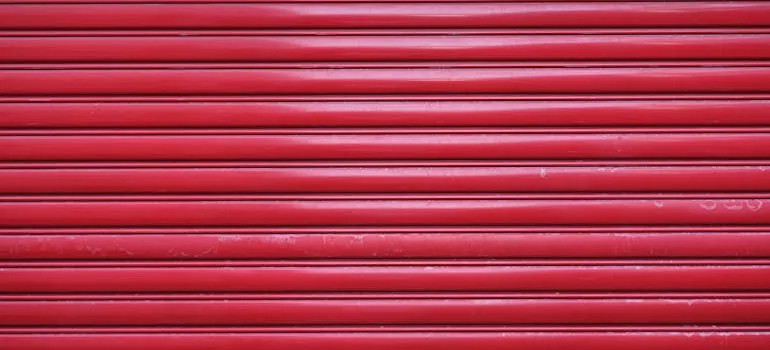 A red door to a storage unit you can rent after discovering what to consider before moving into a DC apartment.