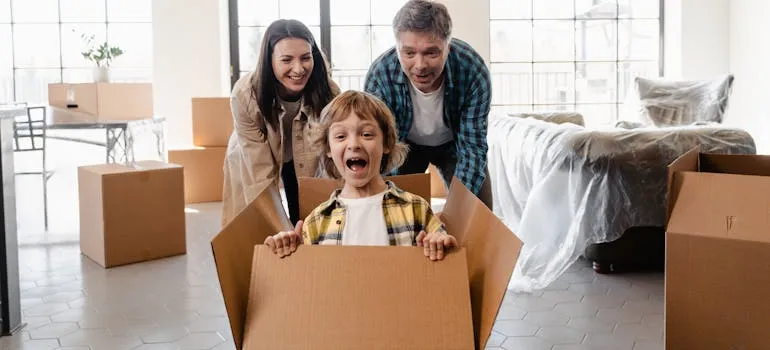 a family having fun while they are moving